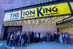  Band students in front of the Lion King marquee